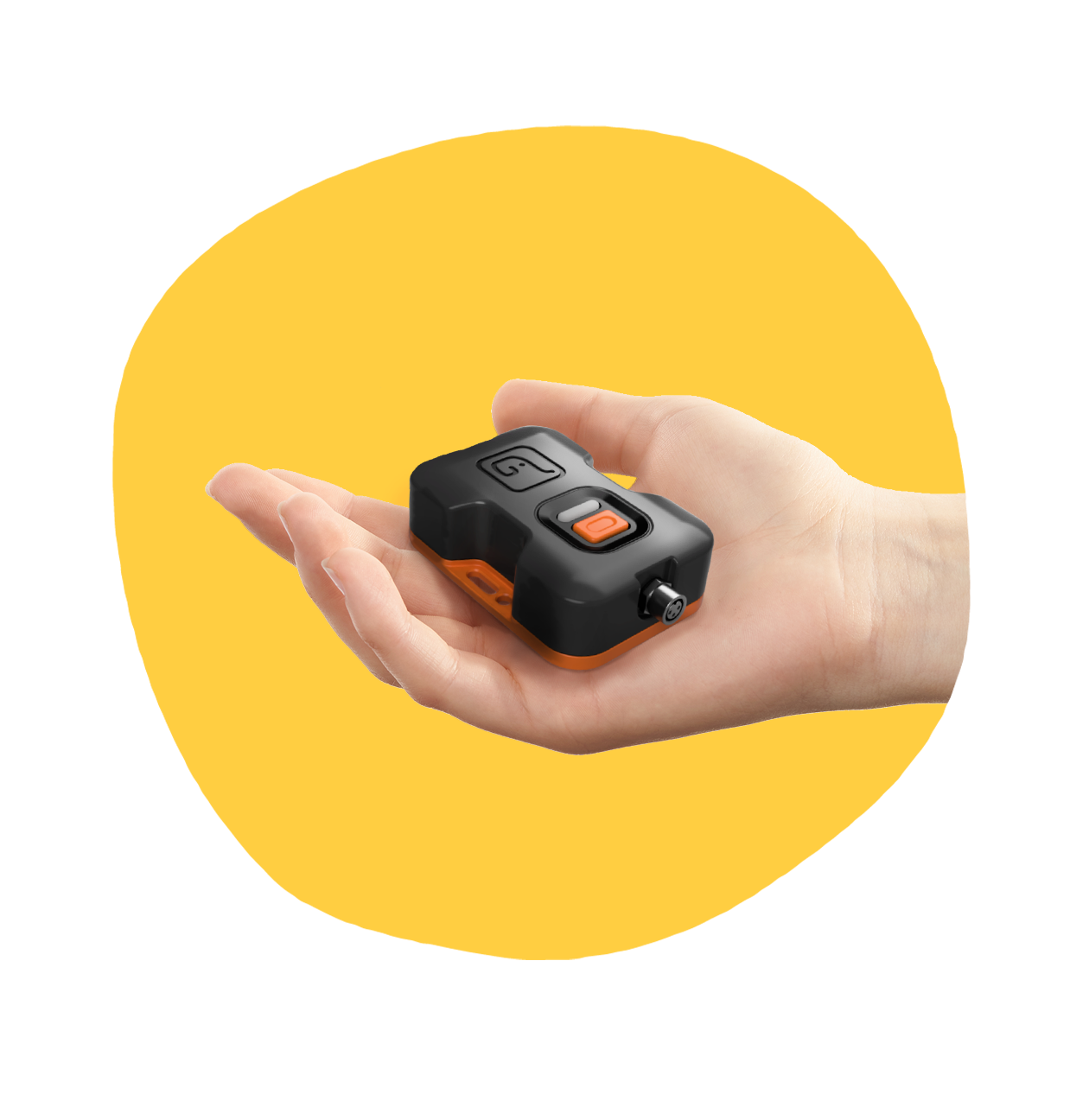 A temperature monitoring device held in a hand on a yellow background